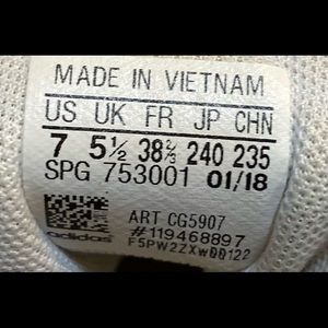 Athleisure, old school Adidas white sneakers